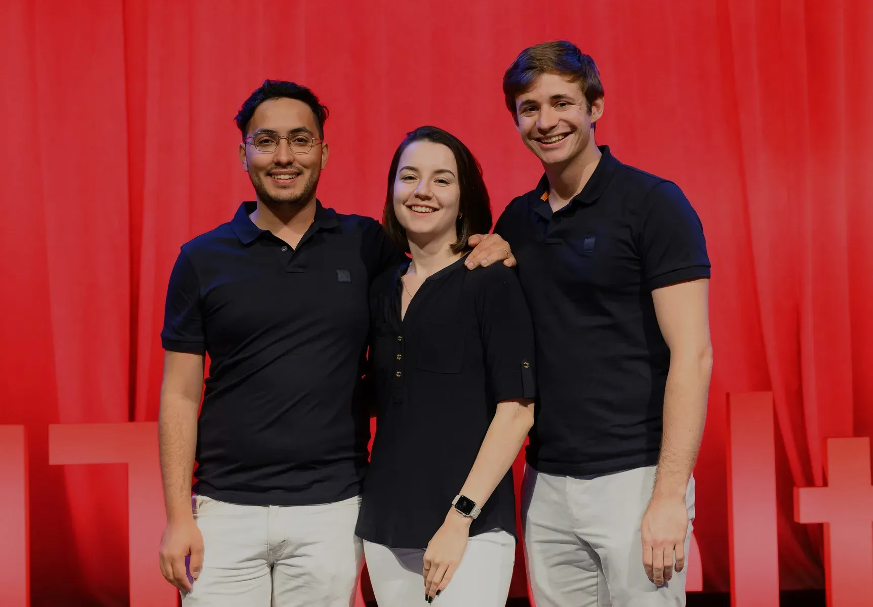 EQORE's founders in front of a red backdrop at Harvard Innovation Labs